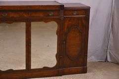 Mahogany credenza with leather top and mirrored doors; 21-2704