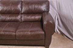 Brown leather type sofa; 1152-110