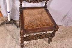 Heavily carved accent chair with barley twist legs, columns, and stretchers; 192-3100