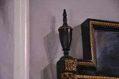 Black and gold mirror with low marble top console table; 55-12187