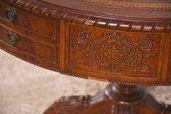 Round carved mahogany 2 drawers center table with leather top; 55-12235