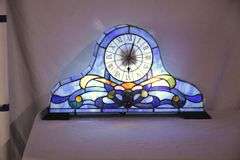 Stained glass Napoleon style mantle clock with lighted interior; 1116-734