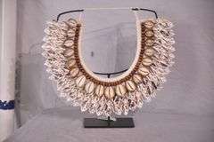 Puka shell necklace on stand; 16780-016