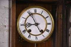 Vintage wall clock with carved walnut case; 18305-031