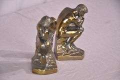 Pair of gold metal Thinking Man bookends; 1037-1159