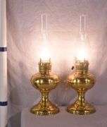 Pair of electric converted brass oil lamps; 396-1395