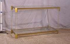 Lucite and gold metal console table with glass top and shelf; 74-12880