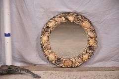 Small round mirror with seashell frame; 55-12218G