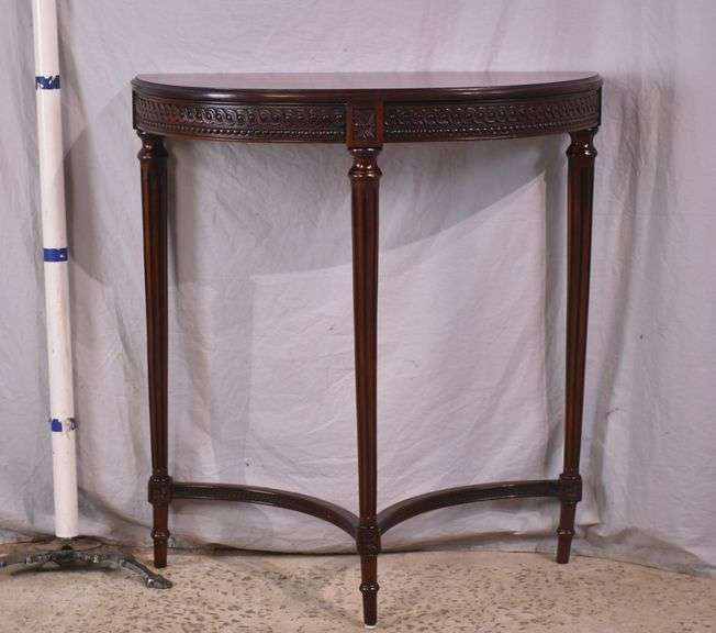 Carved mahogany demilune console table; 68-7158