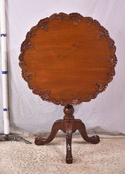 Carved mahogany tilt-top side table; 68-7329