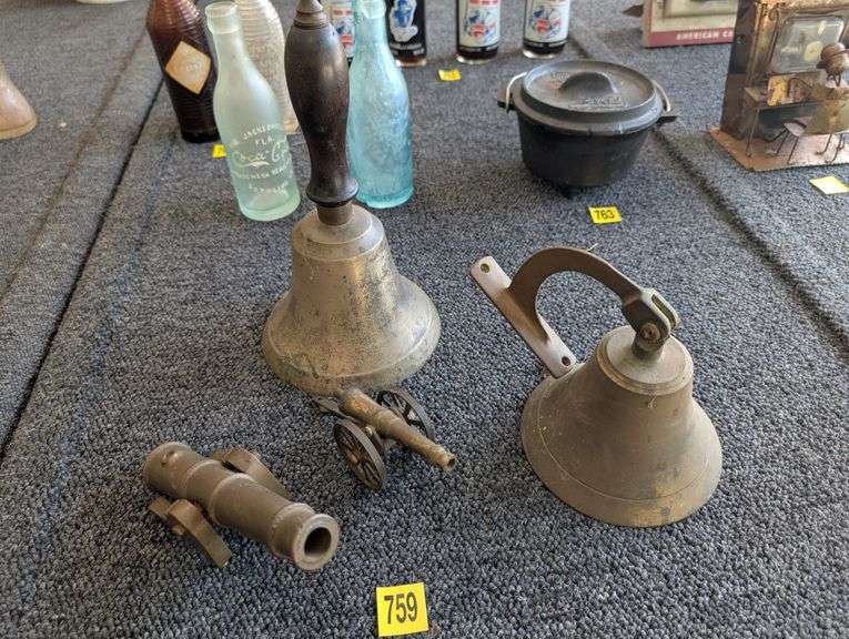 Lot of two miniature brass cannons, and two brass bells