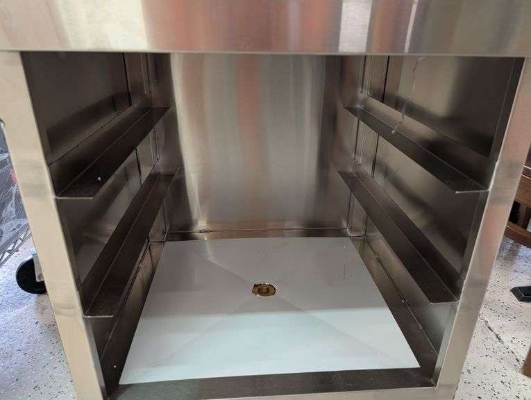 Klinger's under bar open storage with drain. NEW