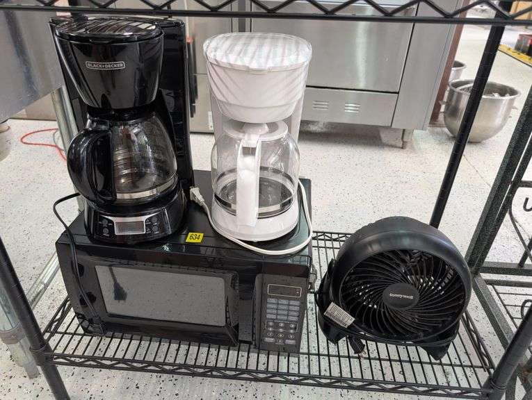Lot of microwave, coffee makers, and fan.