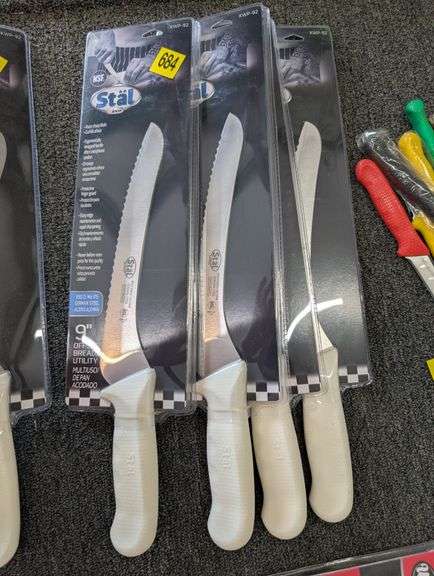 lot of four Stäl 9" serrated kitchen knives.