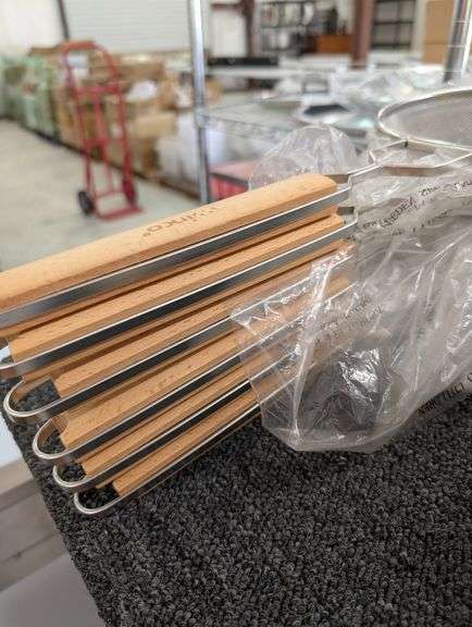 A lot of six 10 inch Winco strainers