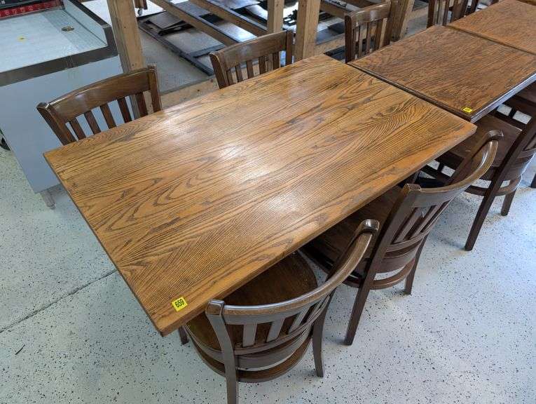 4'x30" wooden table with four chairs.