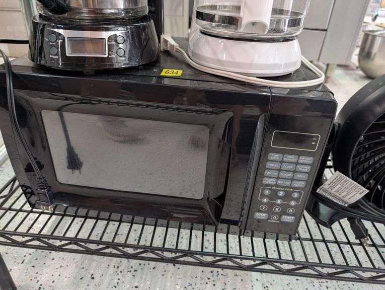 Lot of microwave, coffee makers, and fan.