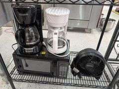 Lot of microwave, coffee makers, and fan.