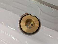 Klinger's under bar open storage with drain. NEW