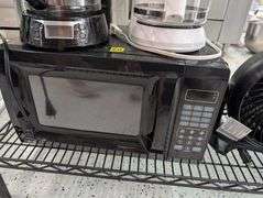 Lot of microwave, coffee makers, and fan.