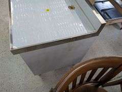 Klinger's under bar open storage with drain. NEW