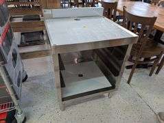 Klinger's under bar open storage with drain. NEW