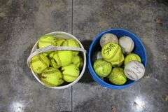 2 - 5 gal. pails of softballs