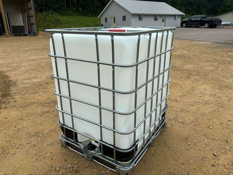 325 gal. poly tote in metal cage
