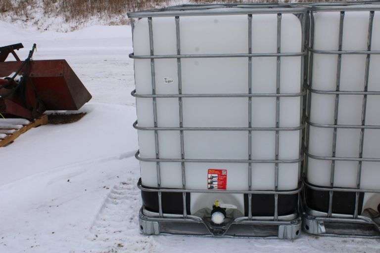325 gal. poly tote in metal cage