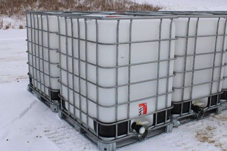 325 gal. poly tote in metal cage