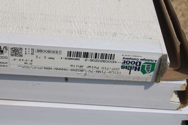 New 8'2 w x 9' 9" tall insulated garage door w/hardware