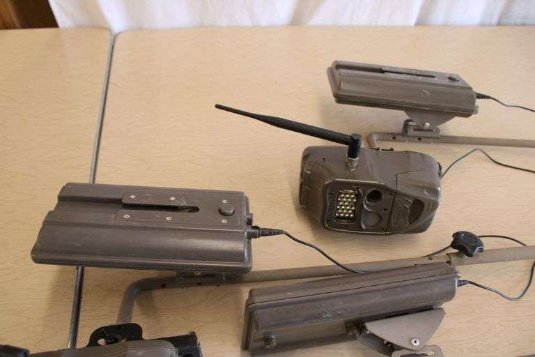 10 Cuddeback game cameras w/poles & accessories