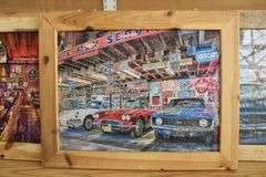 4 Old Garage themed framed puzzles, 23" x 29"