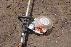 Stihl FS100 RX gas string trimmer w/extra string