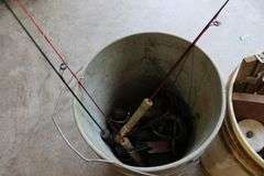 2 pails of ice fishing poles & tip ups