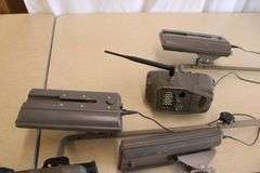 10 Cuddeback game cameras w/poles & accessories