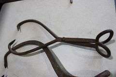 2 antique ice tongs