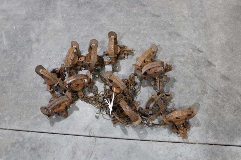 12 double spring animal traps - Lee Real Estate & Auction Service