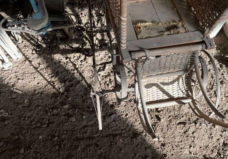 Antique steel, wheeled baby buggy