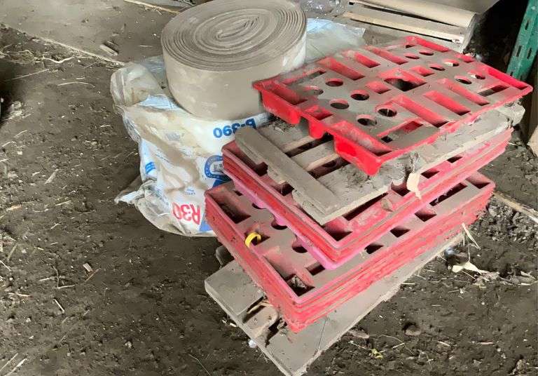 Roll of R30 fiberglass insulation, foam weatherstripping, plastic and wooden feed bag pallets