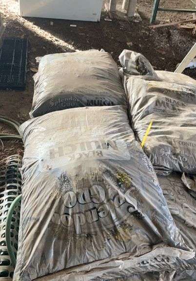 Pallet containing bagged, black mulch