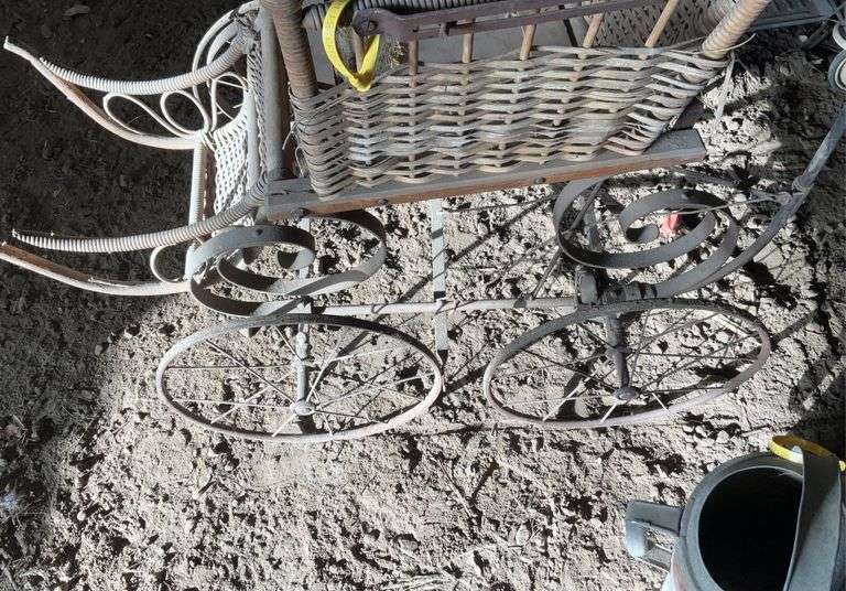 Antique steel, wheeled baby buggy