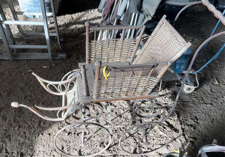 Antique steel, wheeled baby buggy