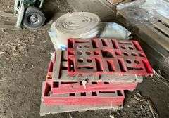 Roll of R30 fiberglass insulation, foam weatherstripping, plastic and wooden feed bag pallets