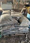 Pallet containing bagged, black mulch