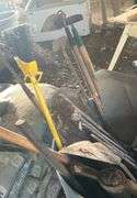 Plastic barrel containing handle tools-hoes,shovels, rakes,brooms, pry bar