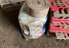 Roll of R30 fiberglass insulation, foam weatherstripping, plastic and wooden feed bag pallets