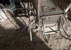 Antique steel, wheeled baby buggy