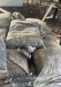 Pallet containing bagged, black mulch