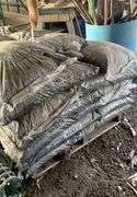 Pallet containing bagged, black mulch